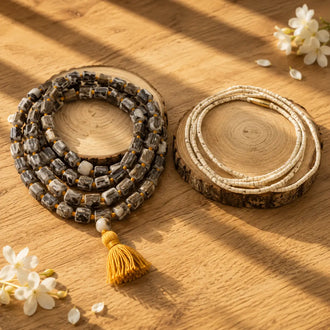 Original Tulsi Combo with a 108-bead Tulsi Japa Mala and a bead Tulsi Kanthi Mala displayed on wooden slices