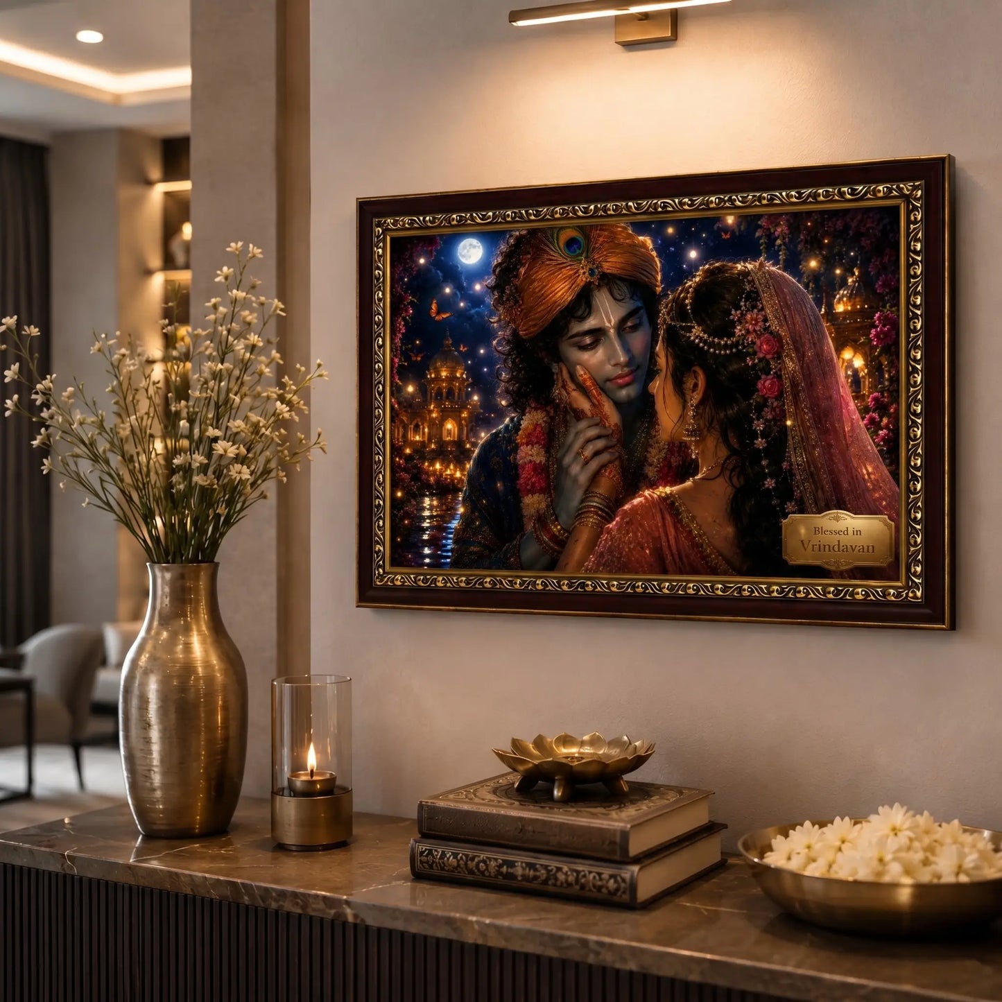 Framed artwork of Radha krishna on a wall above a decorative table.