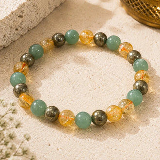 money magnet bracelet on a sandy surface.