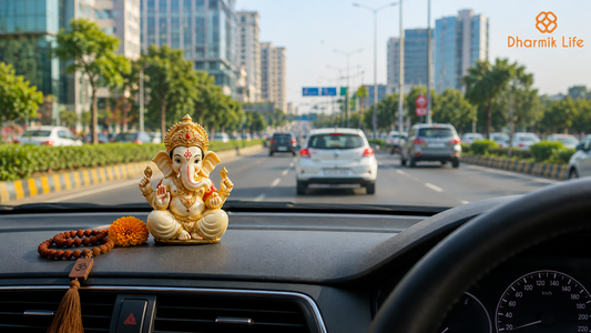 small ganesha idol placed on a car dashboard.
