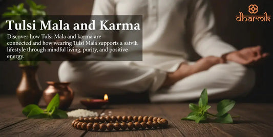 Tulsi mala beads placed on a wooden surface with fresh tulsi leaves, a diya, and a person meditating in the background, symbolizing the connection between Tulsi Mala, karma, and a satvik lifestyle, with the Dharmik logo displayed.