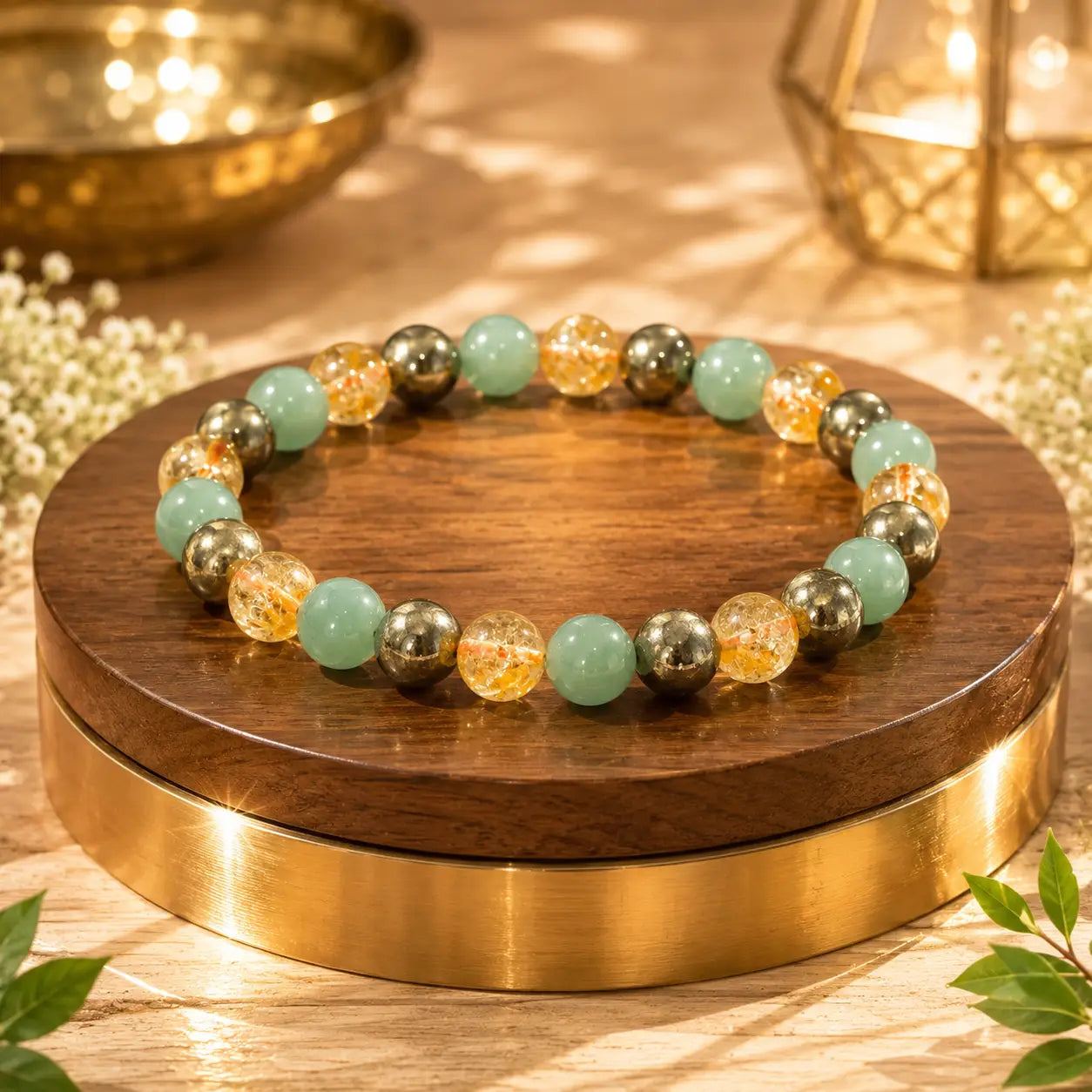 money magnet bracelet on a wooden and gold stand with decorative elements.