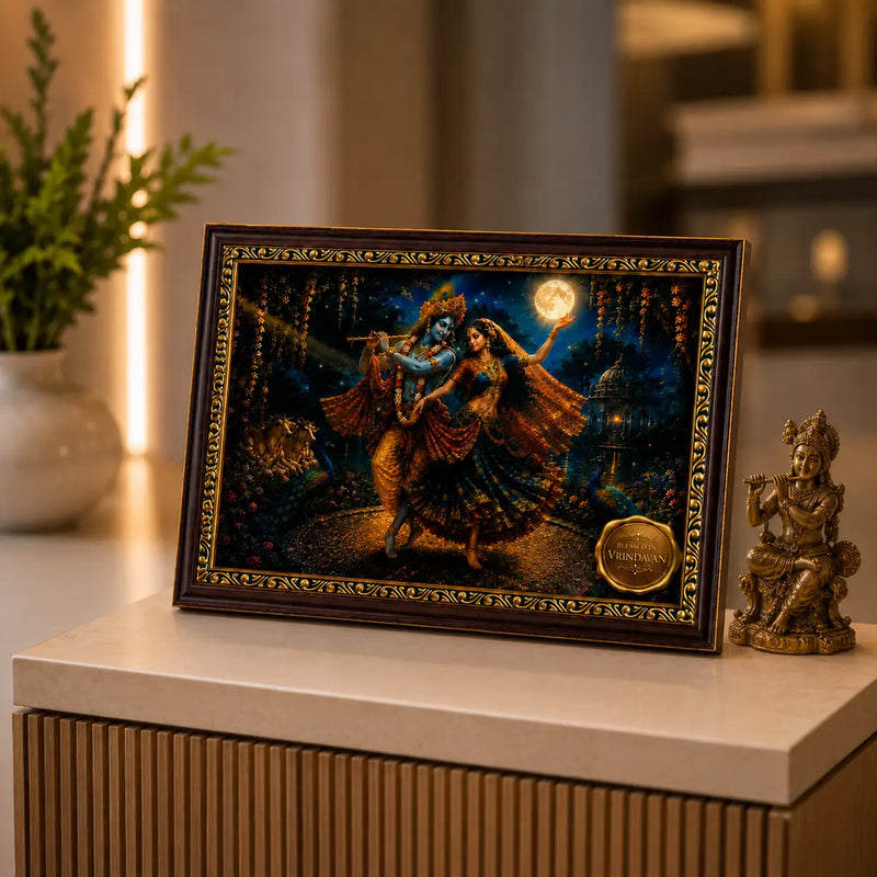 Framed artwork of Radha Krishna with decorative elements on a surface.