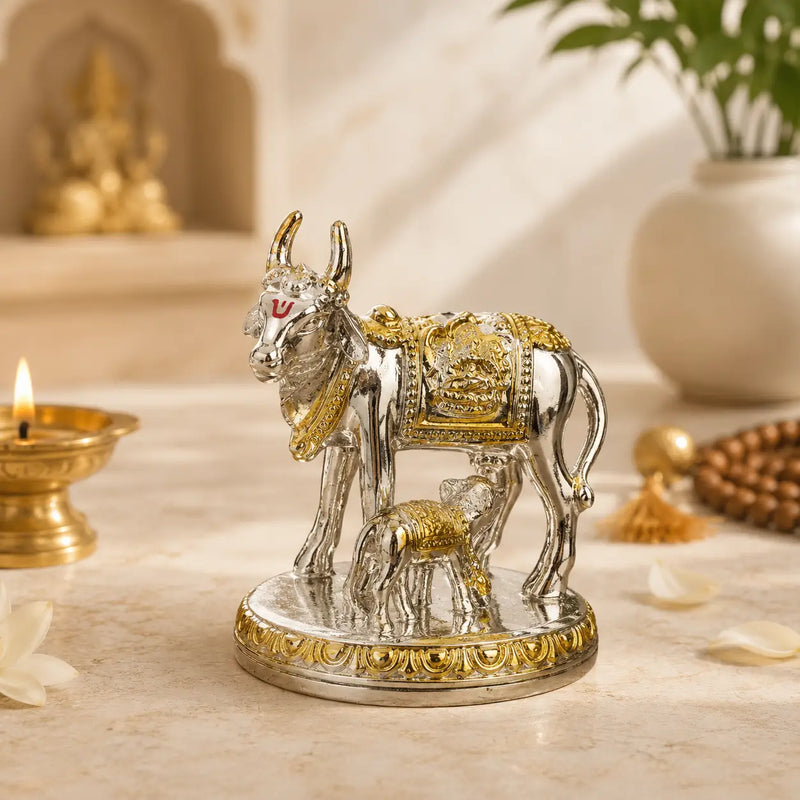 DharmikLife Kamadhenu Cow and Calf silver-gold idol for prosperity and blessings.