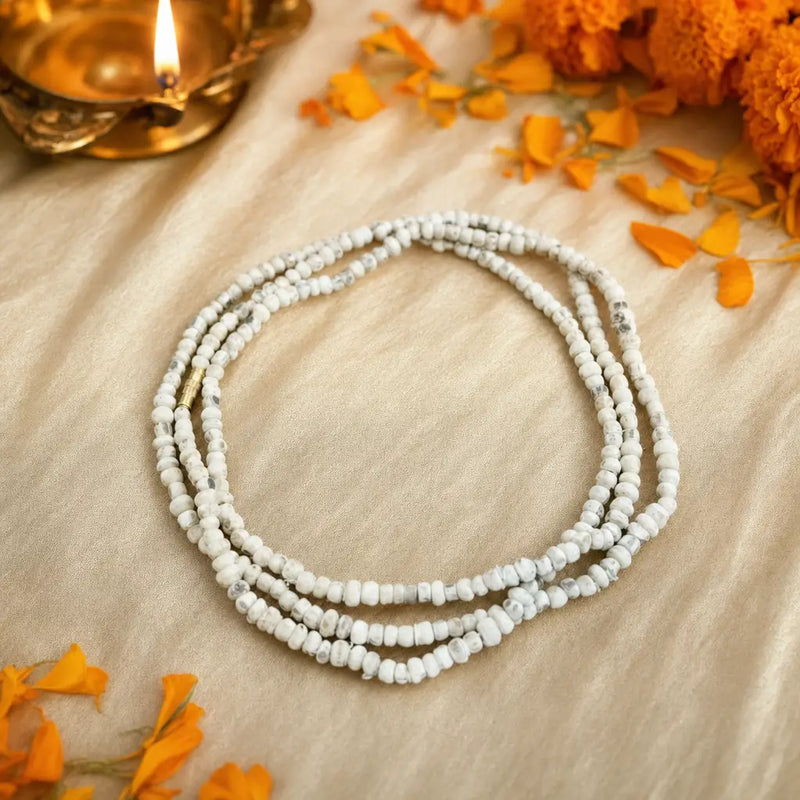 original tulsi kanthi mala triple round placed on a beige cloth