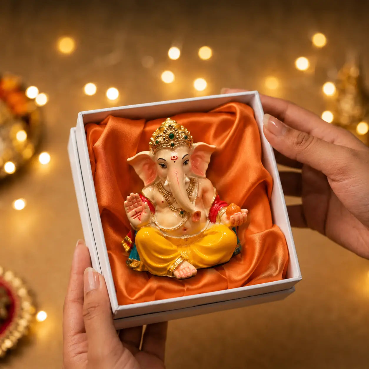 DharmikLife Lord Ganesha idol in premium gift packaging, perfect for home décor, gifting, blessings, and positive energy.