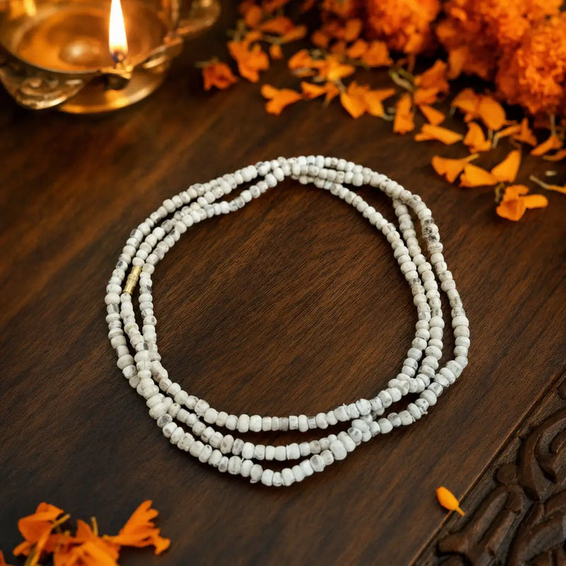 Original tulsi kanthi mala triple round 6mm placed on a wooden plate
