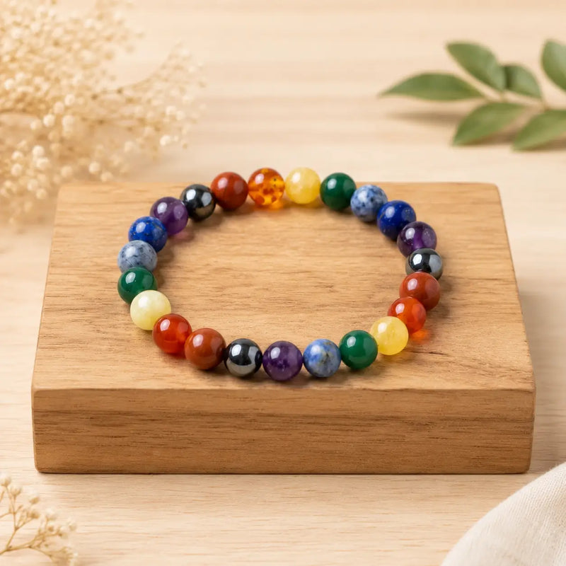 7 Chakra beaded bracelet on a wooden block with a natural background