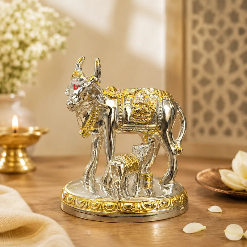 DharmikLife Kamadhenu Cow and Calf silver-gold idol for prosperity and blessings.