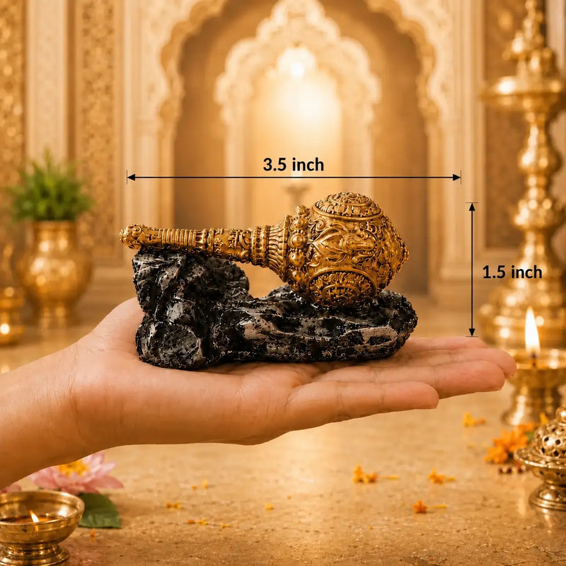 Gada placed on a hand with its length and breadth displaying 