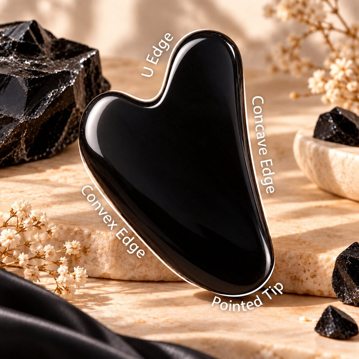 sides of black obsidian crystal Gua Sha 