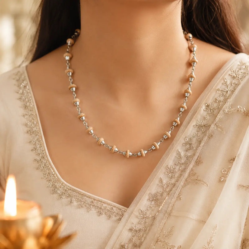 Handcrafted 92.5 Silver Tulsi Mala around a women's neck 
