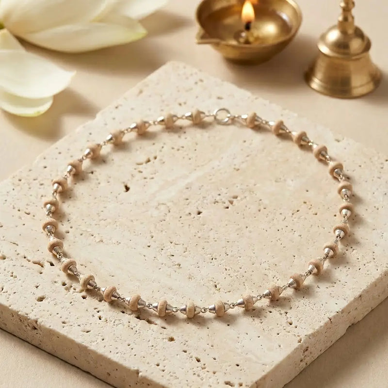 Handcrafted 92.5 Silver Tulsi Mala with natural Tulsi beads placed on a white plate