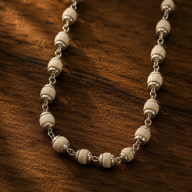 Silver Plated Tulsi Mala  ( 54 Beads, 6 mm), placed on wooden plate