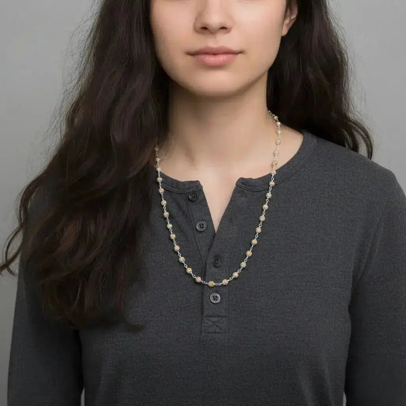 female wearing silver tulsi mala